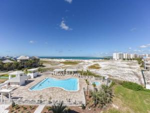 an aerial view of a pool and the beach at Magnolia House at Destin Pointe III in Destin