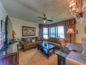 a living room with a couch and a table at Mainsail II in Destin