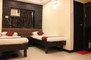 En eller flere senge i et værelse på Hotel Fortune