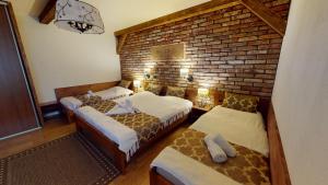 A bed or beds in a room at Apartmán Marta, 200 m Ski Tatranska Lomnica
