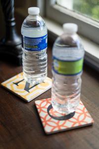 two bottles of water sitting on top of a table at Evangeline Art House in New Orleans