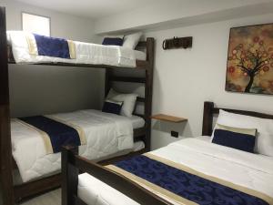 Postel nebo postele na pokoji v ubytování Hotel Palmi