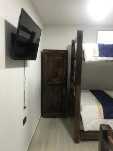 Postel nebo postele na pokoji v ubytování Hotel Palmi