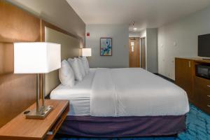 a hotel room with a bed and a table with a lamp at Red Lion Templin's Hotel on the River in Post Falls +37 photos