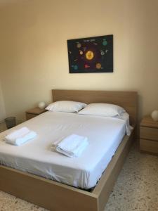 Postel nebo postele na pokoji v ubytování B&B PARCO 2 GIUGNO