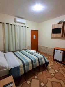 Postel nebo postele na pokoji v ubytování Pousada Capim Dourado + 25 fotografií