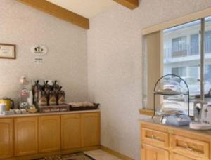 a kitchen with a counter and a window in it at Super 8 by Wyndham Susanville in Susanville