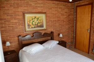 A bed or beds in a room at Casa em penedo
