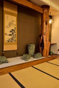 Postel nebo postele na pokoji v ubytování Takenoya Ryokan (Guest House Takenoya)