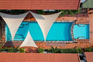 an overhead view of a swimming pool in a building at Victory Road Villas in Phong Nha