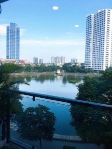 a view of a river in a city with tall buildings at Tài Tâm - Grand Spring Suites in Hanoi