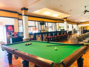 a pool table in a room with a bar at Phan Thiet Ocean Dunes Resort in Phan Thiet