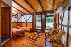 a bedroom with a bed and a desk in a room at Hotel Avion - Self check in in Plovdiv