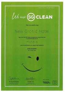 a green card with a smiley face on it at New Orchid Hotel in Singapore