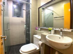 a bathroom with a sink and a toilet and a shower at Maison life 小居屋 The Loft Imago in Kota Kinabalu