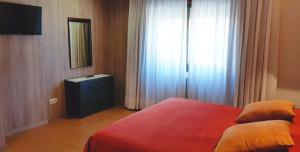 A bed or beds in a room at El Retiro