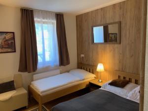 Postel nebo postele na pokoji v ubytování Apartmany Arber