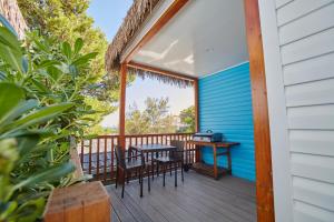 a balcony with a table and chairs on a house at Alannia Costa Dorada in Platja de l’Almadrava