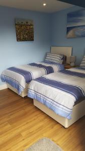 Ένα ή περισσότερα κρεβάτια σε δωμάτιο στο Mango Lodge