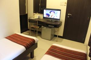 TV a/nebo společenská místnost v ubytování Hotel Fortune