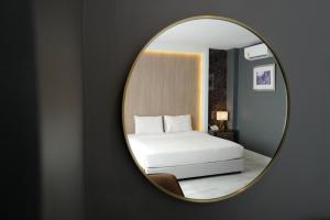 Posteľ alebo postele v izbe v ubytovaní Chaisaeng Palace Hotel