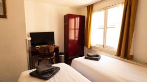 TV a/nebo společenská místnost v ubytování Hotel Internationaal