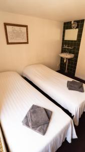 Postel nebo postele na pokoji v ubytování Hotel Internationaal