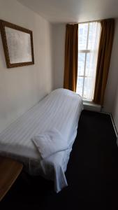 Postel nebo postele na pokoji v ubytování Hotel Internationaal