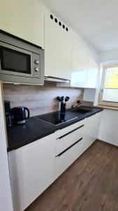 Kuchyň nebo kuchyňský kout v ubytování Sunshine Appartements