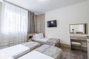Voodi või voodid majutusasutuse Hotel Adrenalin toas
