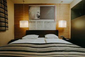 
מיטה או מיטות בחדר ב-Soho Boutique Hotel
