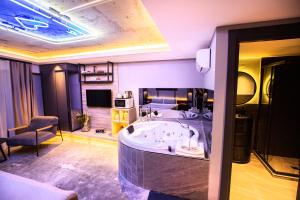TV a/nebo společenská místnost v ubytování Cityloft 64 + 37 fotografií