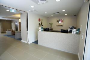 a room with a white wall and a white counter top at Quest Shepparton in Shepparton