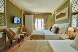 Postel nebo postele na pokoji v ubytování Sunlight Hotel + 37 fotografií