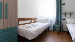 A bed or beds in a room at Italianway - Bagni Nuovi 12