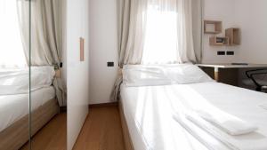 A bed or beds in a room at Italianway - Bagni Nuovi 12