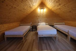 Säng eller sängar i ett rum på Lawendowe Zacisze