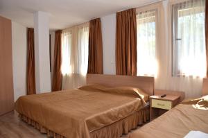 Katil atau katil-katil dalam bilik di Семеен хотел Къщата