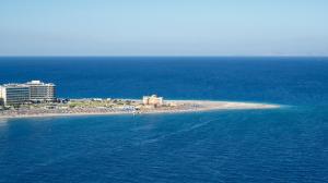 an island in the middle of the ocean at Aquarium View Hotel in Rhodes Town