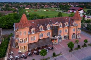an aerial view of a large building with turrets at Garni Hotel Royal Crown in Subotica