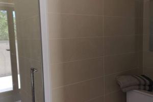 a bathroom with a shower stall and a toilet at Diamond - Gîte dans vieux prieuré près de Carcassonne in Sainte-Eulalie +20 photos