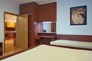 Posteľ alebo postele v izbe v ubytovaní Apartmány Čeladná