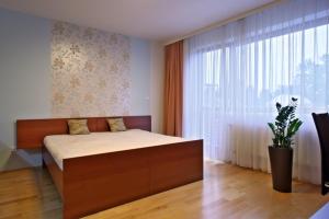 Posteľ alebo postele v izbe v ubytovaní Apartmány Čeladná