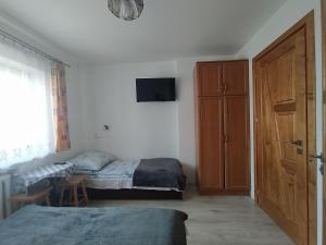 Posteľ alebo postele v izbe v ubytovaní Pokoje Gościnne U Babuni