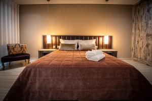 Uma cama ou camas num quarto em Quinta das Oliveiras Turismo Rural