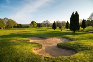 a golf course with a hole in the grass at Sedlescombe Golf Hotel in Sedlescombe