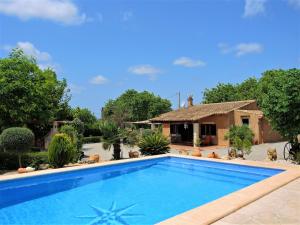 a swimming pool in front of a house at Can jeroni in Sant Llorenç des Cardassar