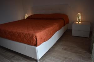 Postel nebo postele na pokoji v ubytování Da Clara e Raffaele