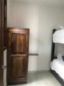 Postel nebo postele na pokoji v ubytování Hotel Palmi