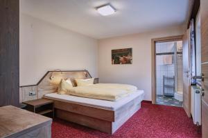 Appartement Sporthütte Fiegl tesisinde bir odada yatak veya yataklar